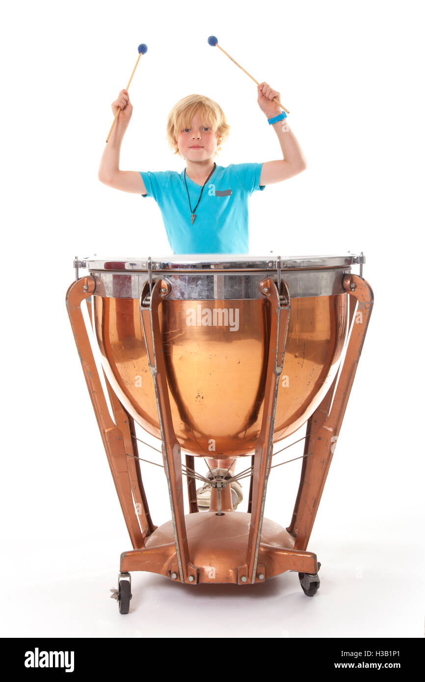 young blond boy playing kettle drum Stock Photo Alamy