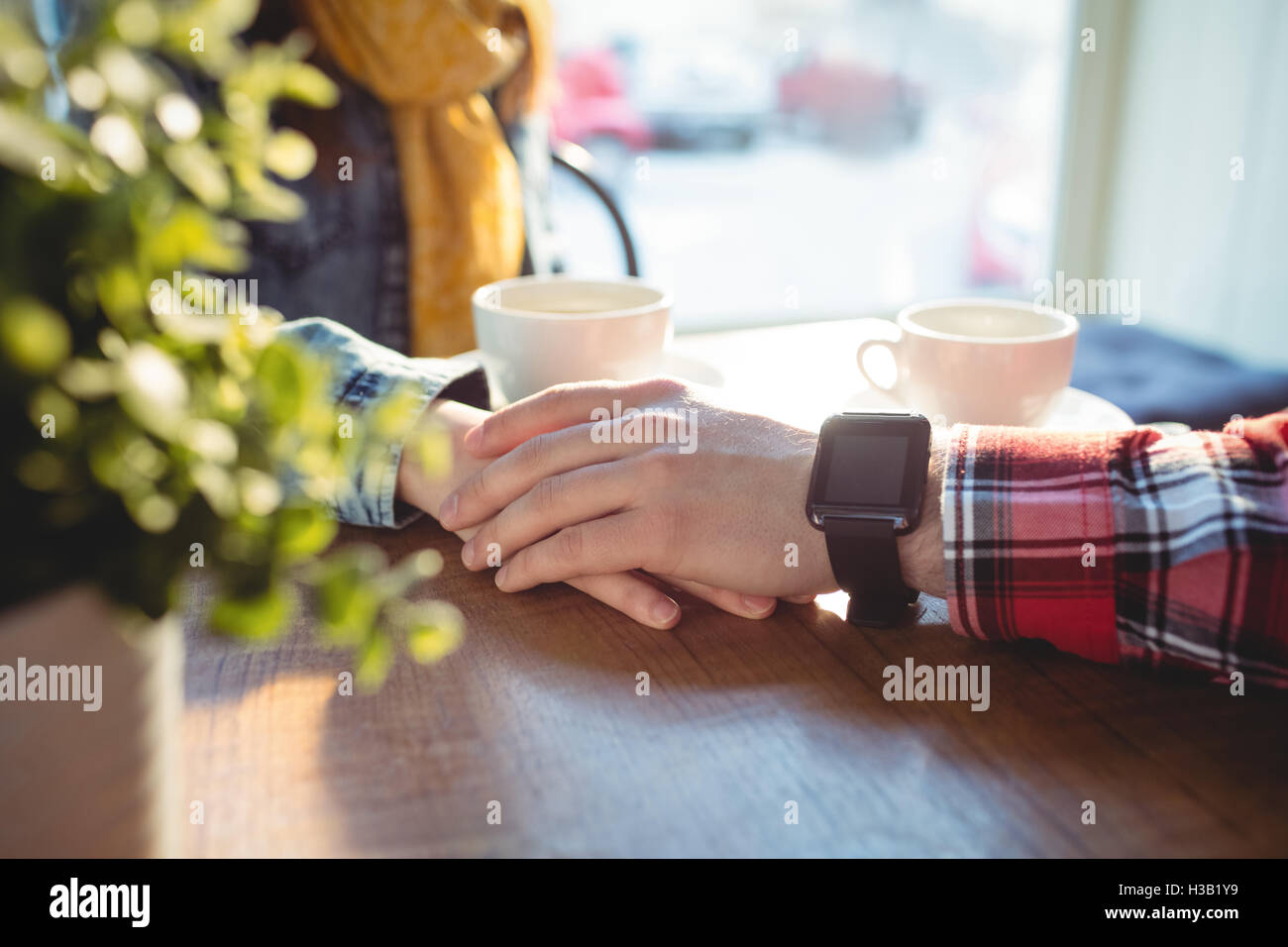 Smart couple holding hands hi-res stock photography and images - Alamy