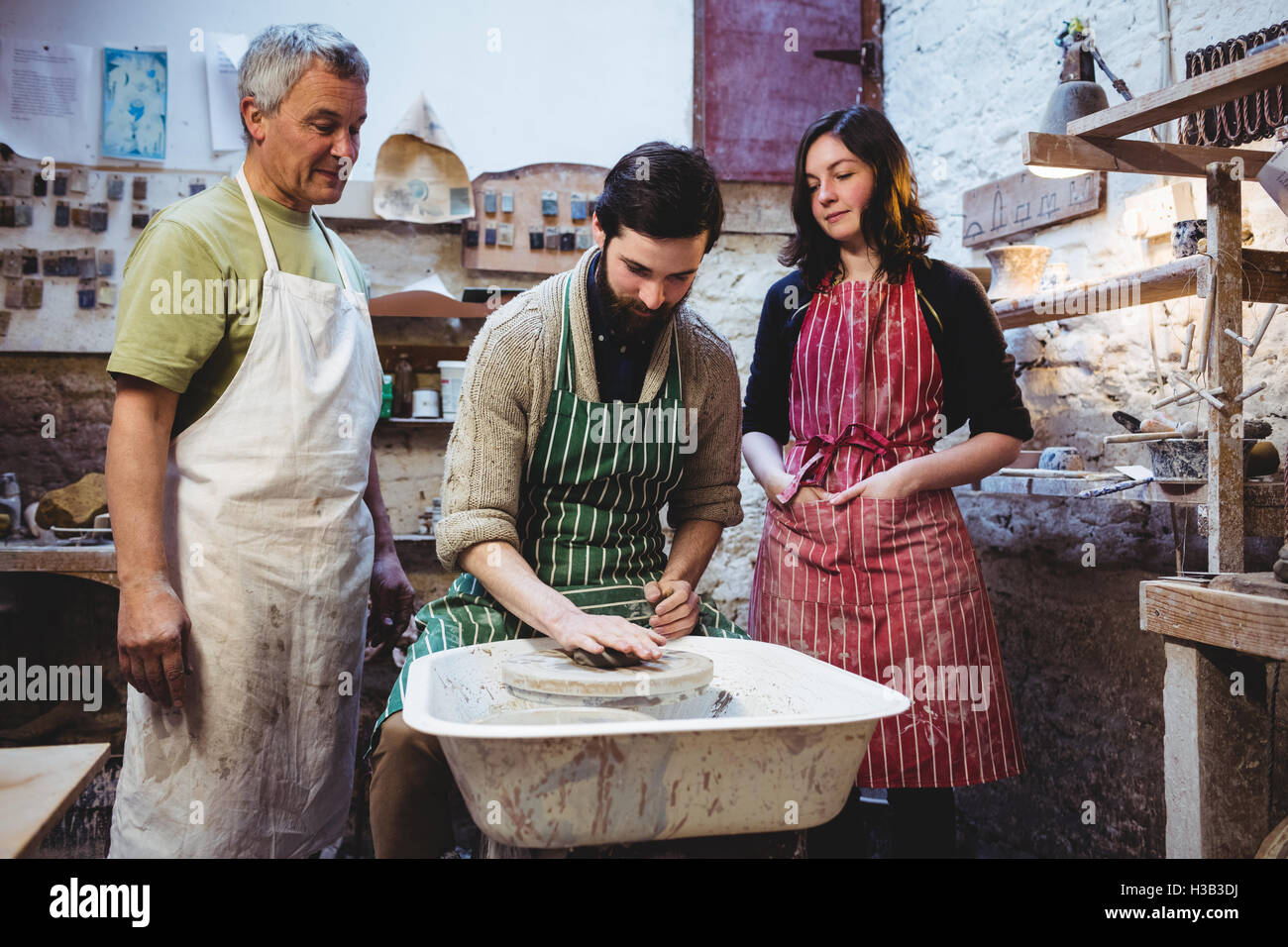 Smiling potters team working Stock Photo - Alamy