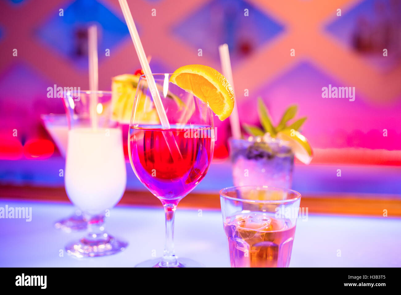 Glasses of drink on bar counter Stock Photo
