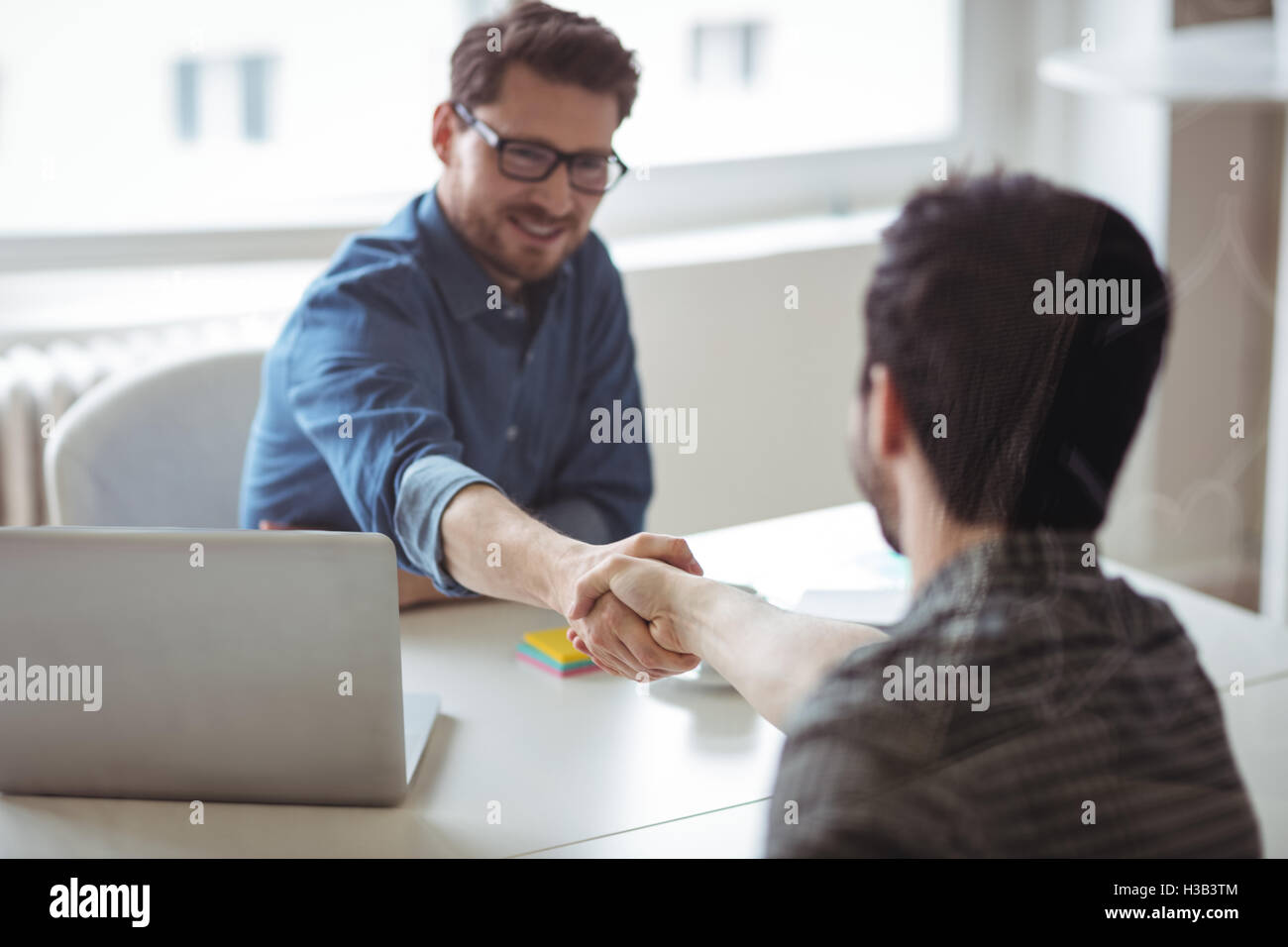 Business people greeting eachother Stock Photo