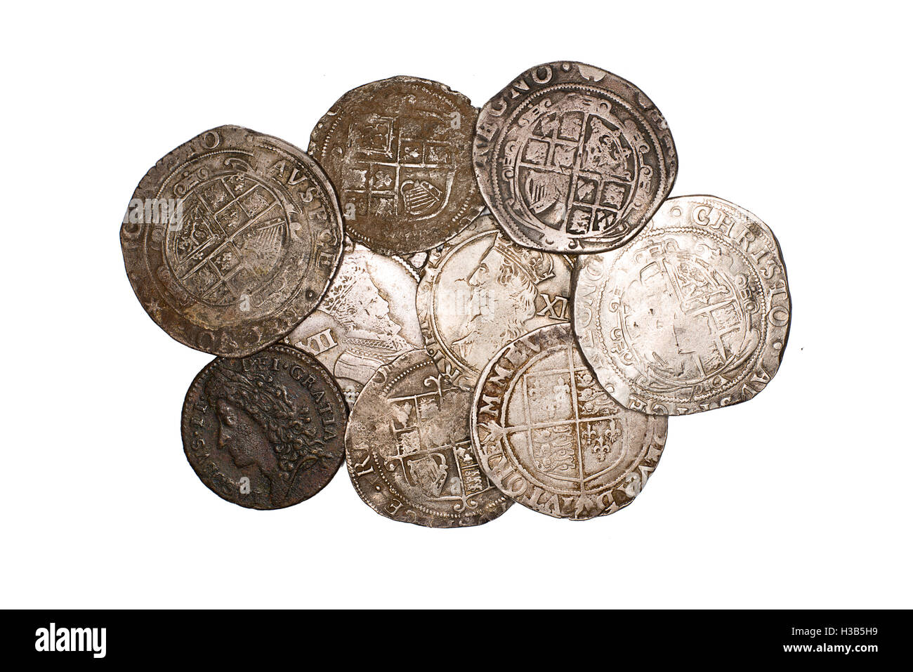 Many ancient silver coins on white Stock Photo