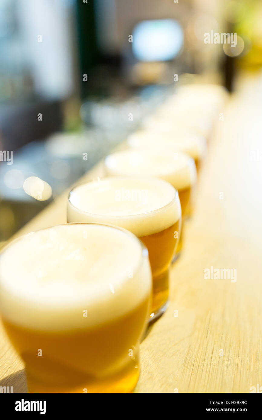 Close-up of beer glasses on the counter Stock Photo