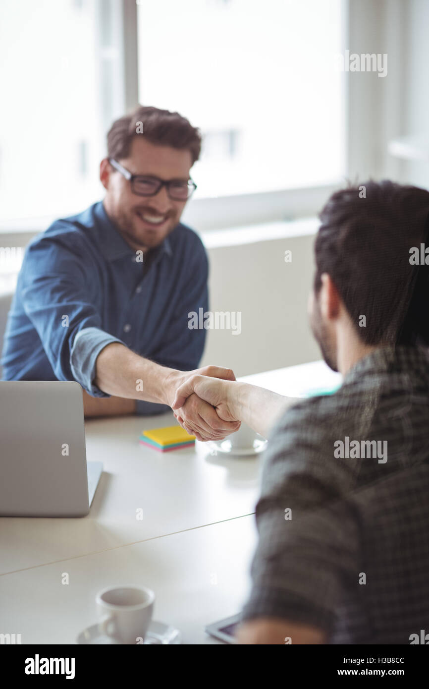 Happy business people greeting each other Stock Photo