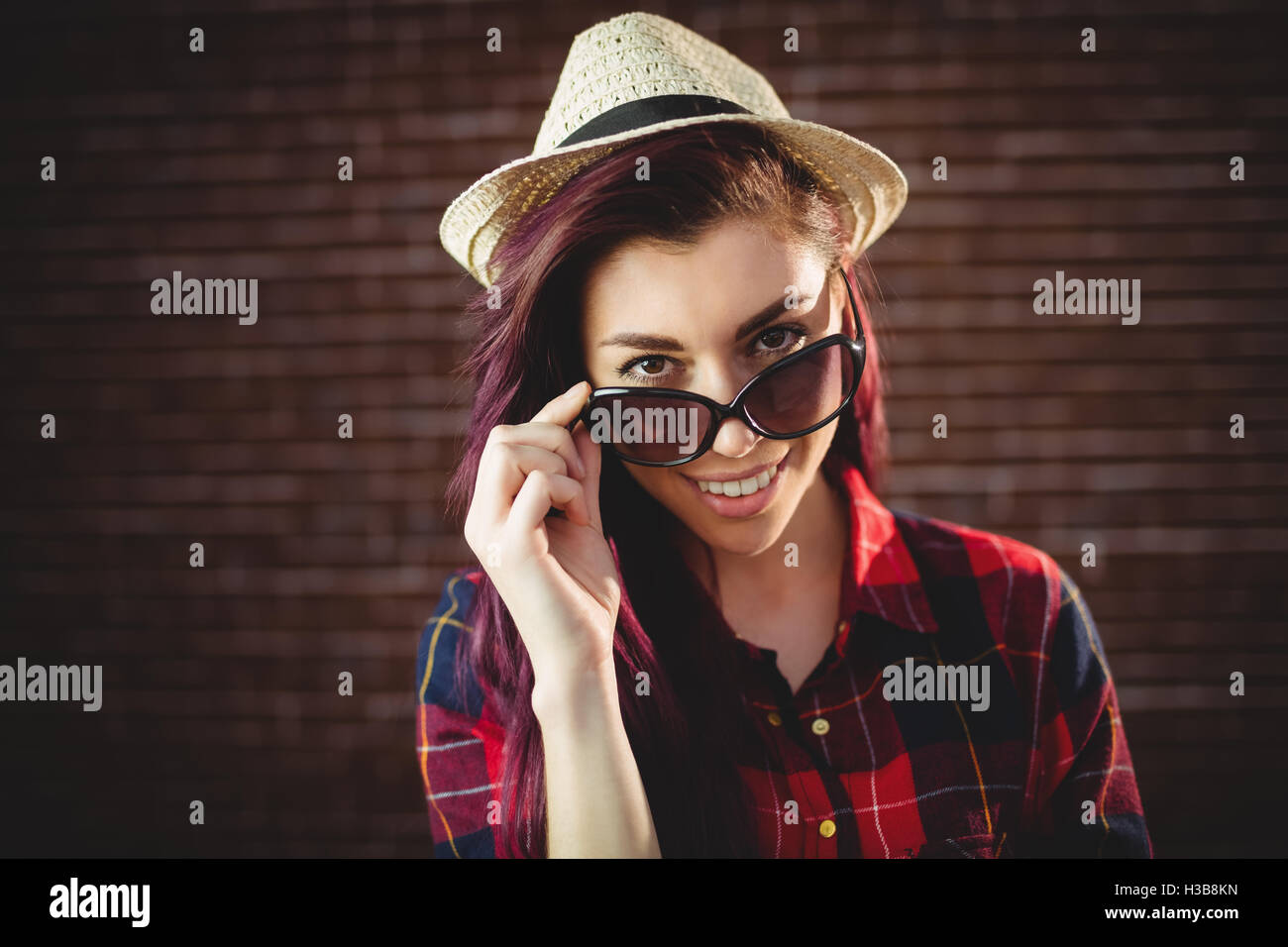 Young woman wearing sunglasses Stock Photo - Alamy