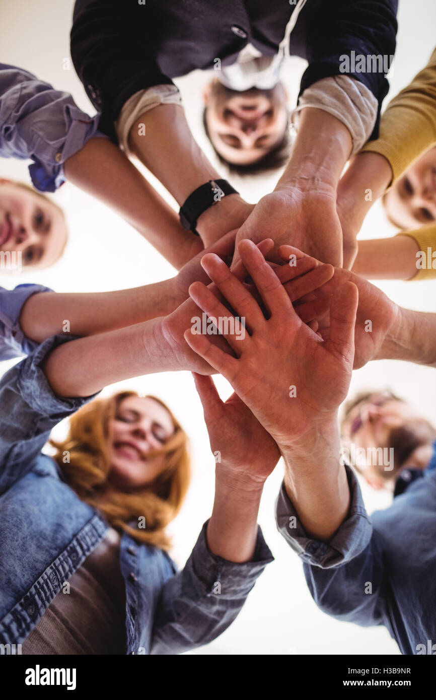 Business people hand stacking in office Stock Photo Alamy