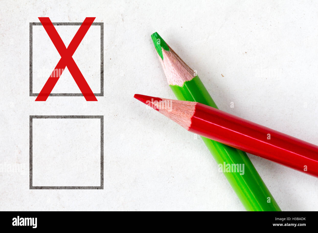 Red and green pencils with marking checkbox. Concept for customer satisfaction survey,education research or election Stock Photo