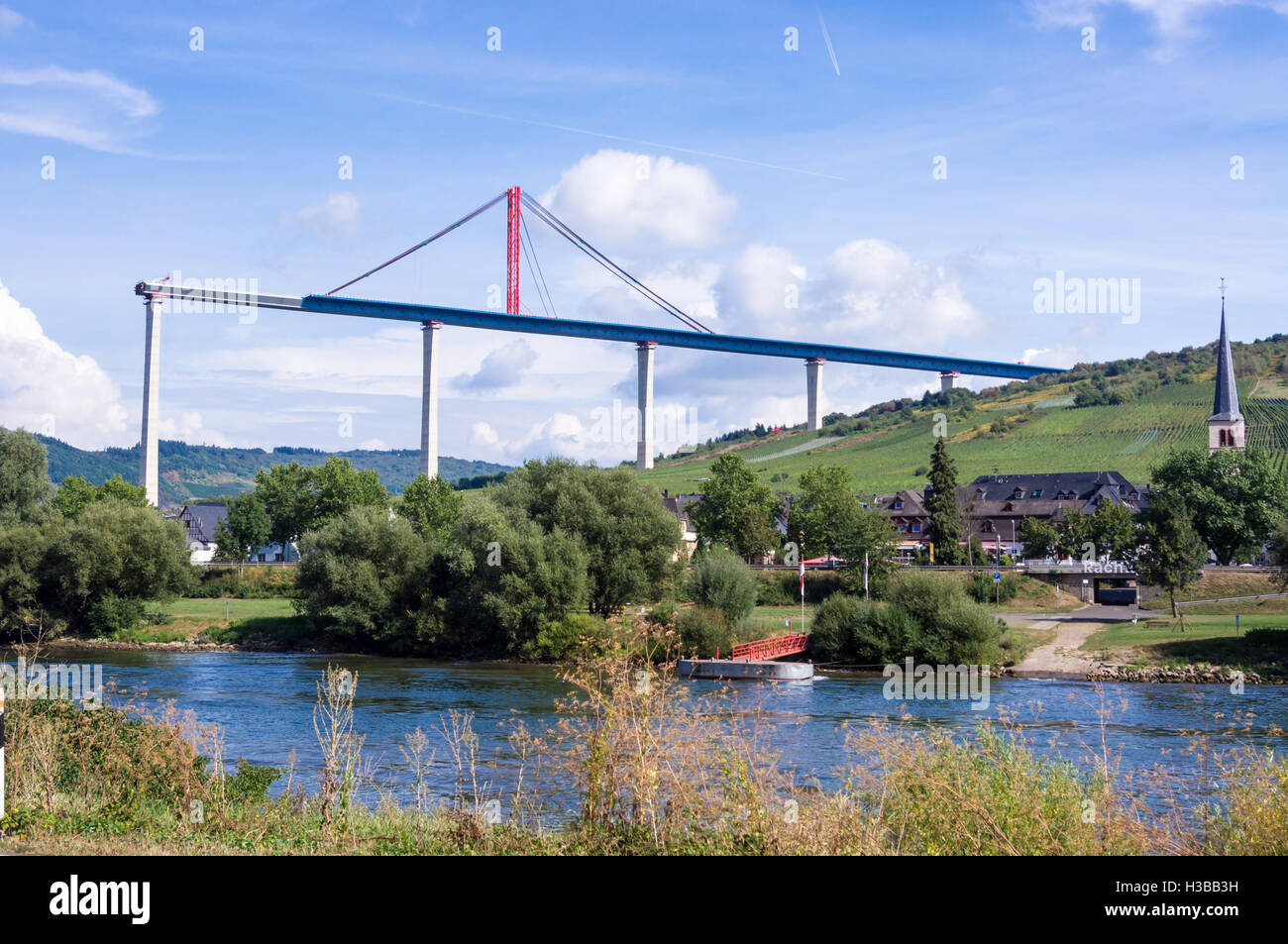 Unfinished Hochmoselübergang B50 motorway bridge, and Zeltingen church, Mosel, Germany Stock Photo