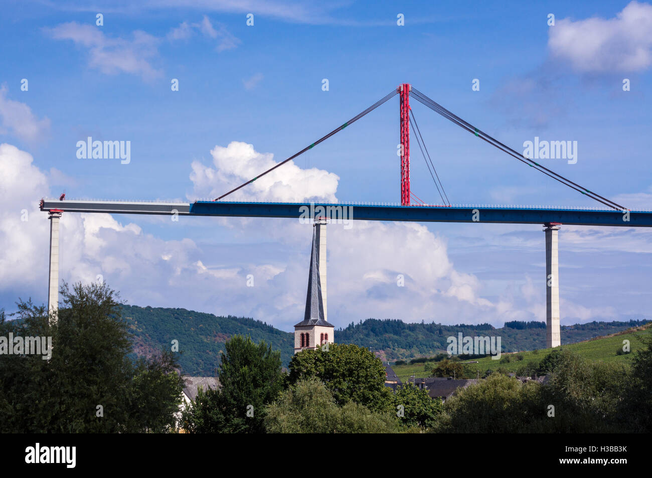 Unfinished Hochmoselübergang B50 motorway bridge, and Zeltingen church, Mosel, Germany Stock Photo