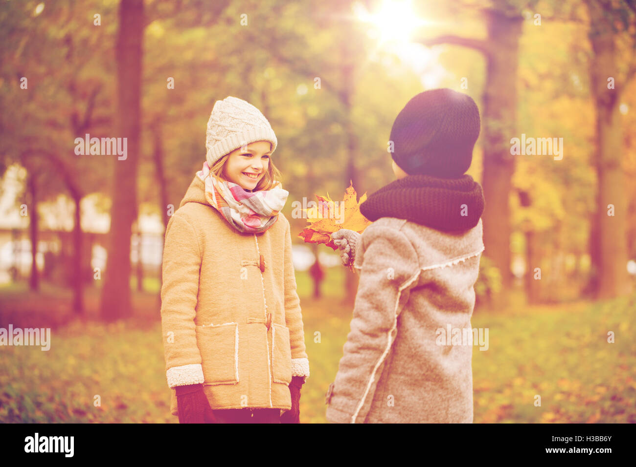smiling children in autumn park Stock Photo - Alamy
