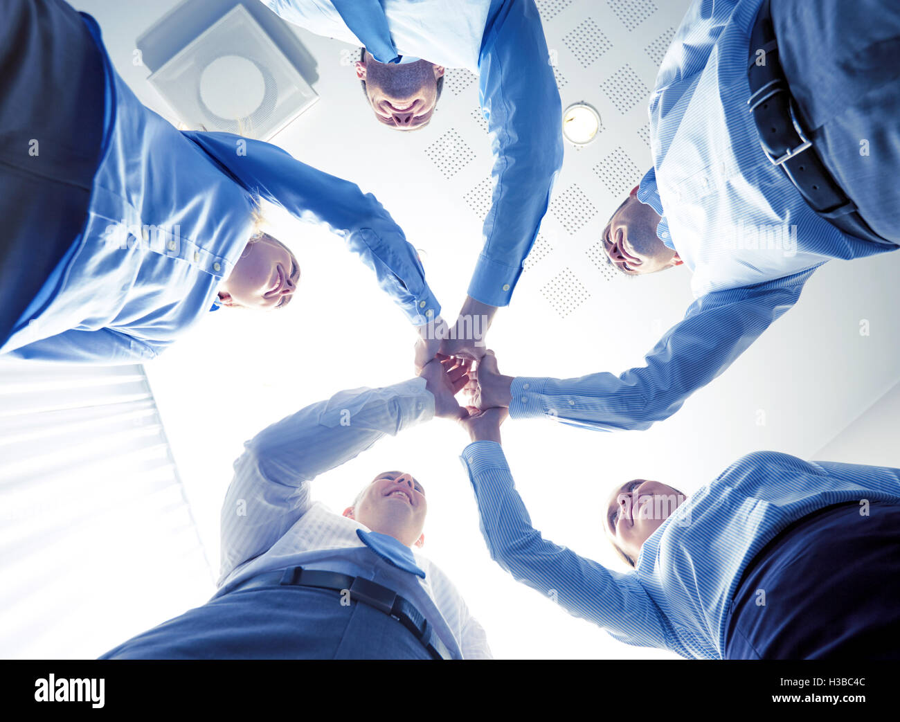 Group five colleagues standing hi-res stock photography and images - Alamy