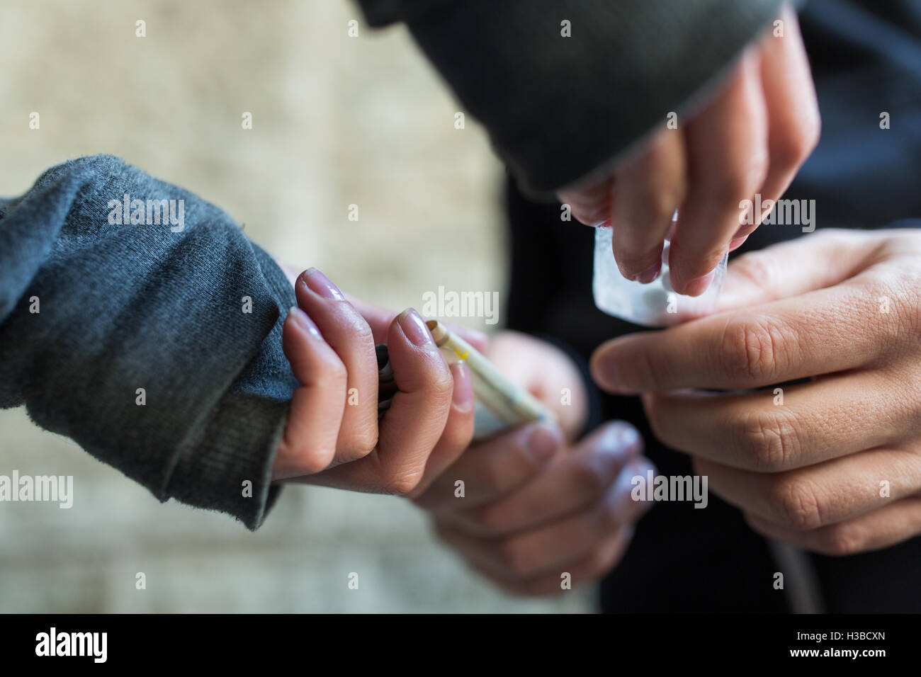 close up of addict buying dose from drug dealer Stock Photo