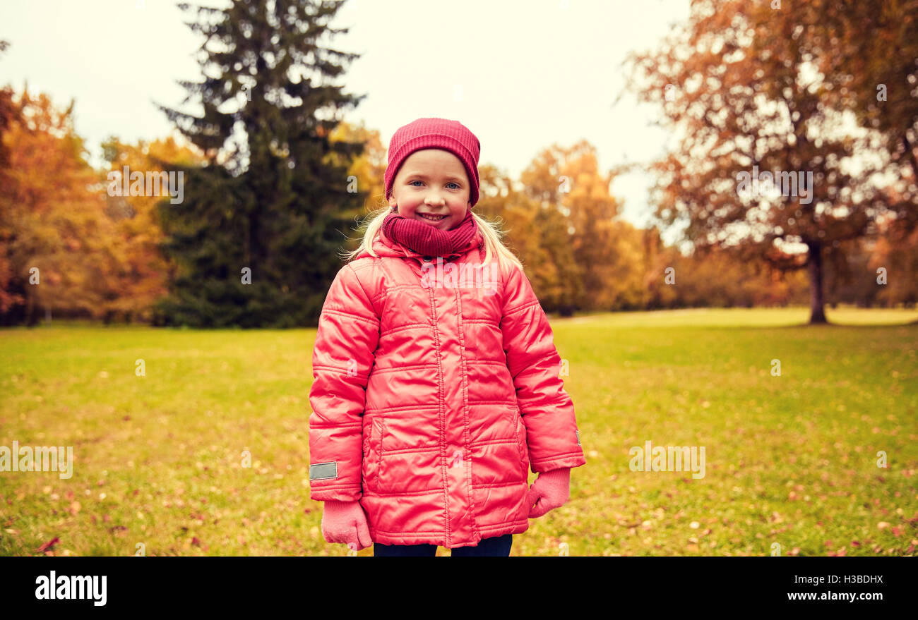 happy little girl in autumn park Stock Photo - Alamy