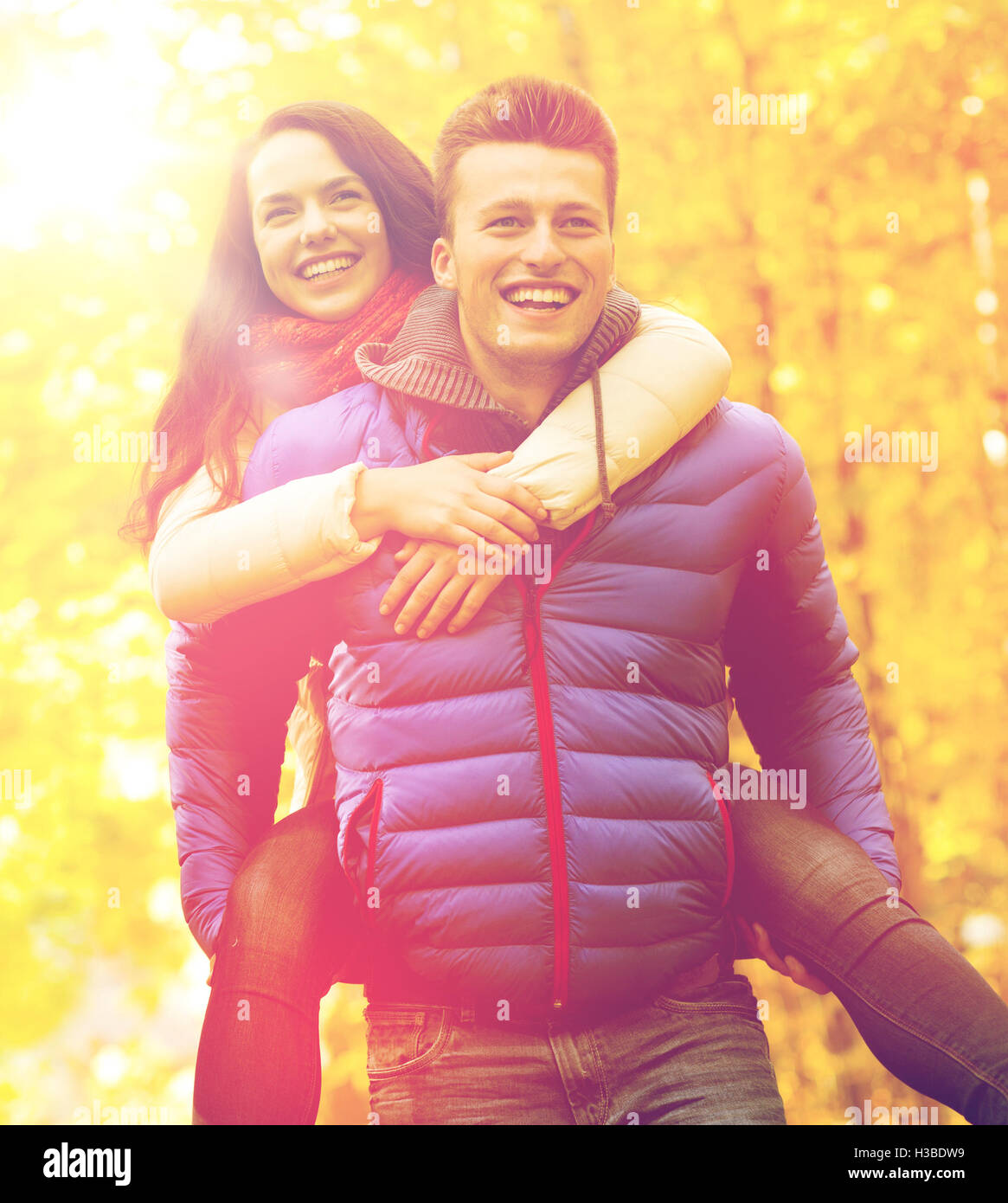 smiling friends having fun in autumn park Stock Photo - Alamy