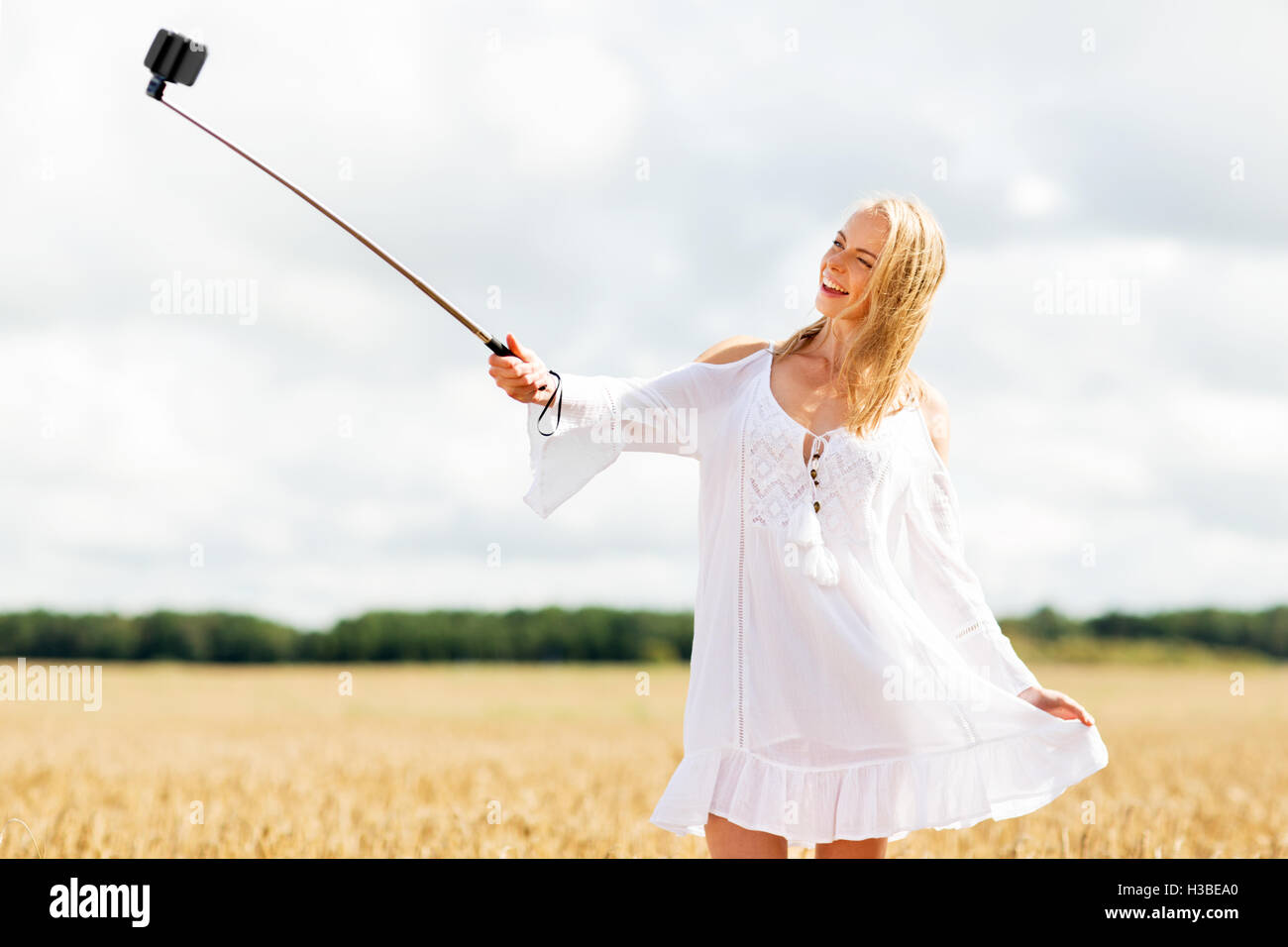 happy young woman taking selfie by smartphone Stock Photo - Alamy