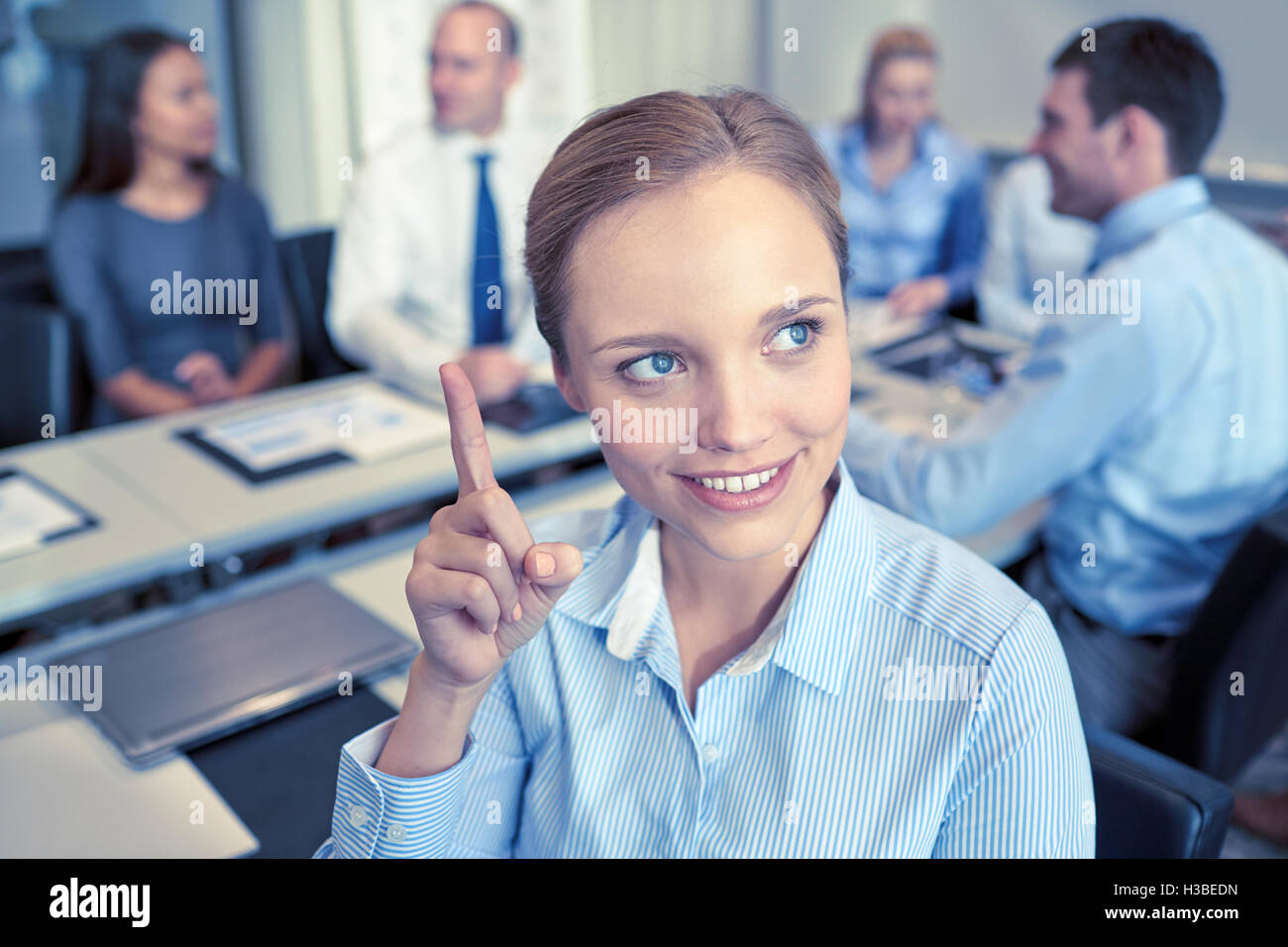 group of smiling businesspeople meeting in office Stock Photo - Alamy