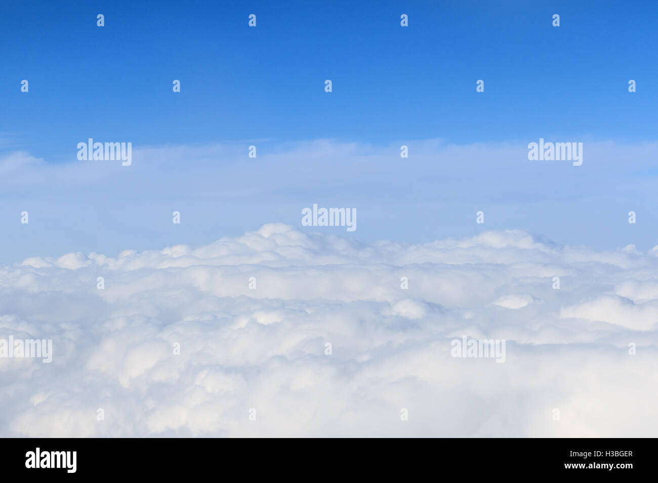 white fluffy clouds high up from a plane Stock Photo