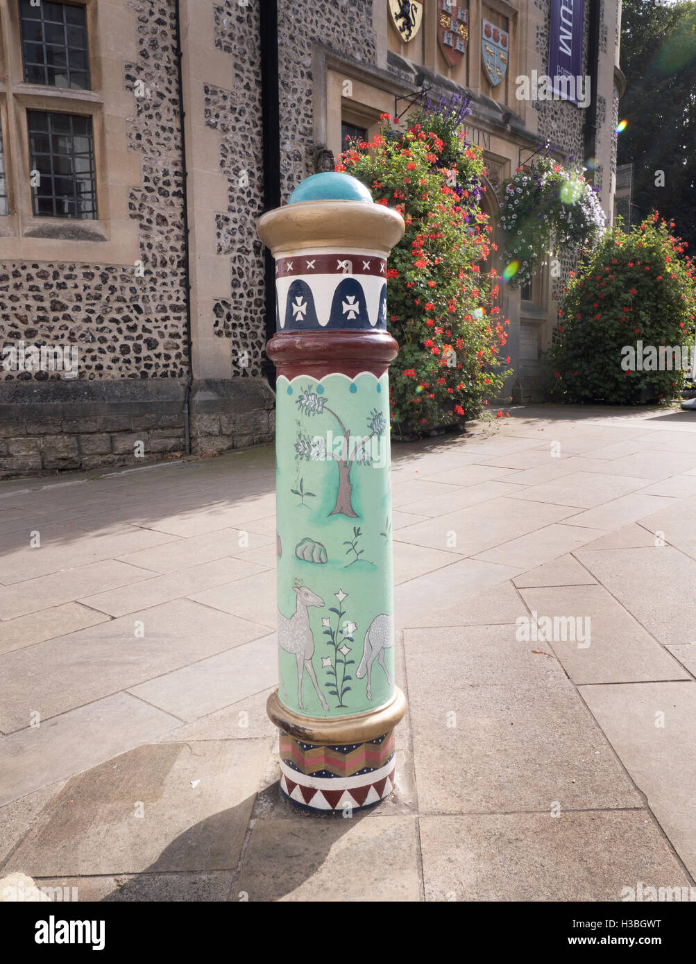 Decorated painted traffic bollards in The Square, Winchester, Hampshire, England, UK Stock Photo