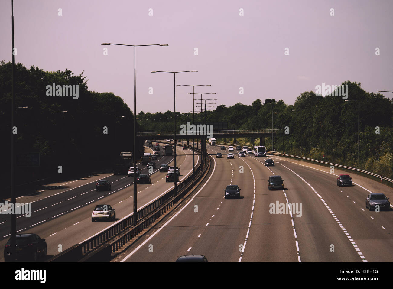 BEACONSFIELD, ENGLAND - JUNE 2016: Busy M40 motorway at the Beaconsfield turn off  Vintage Retro Filter. Stock Photo