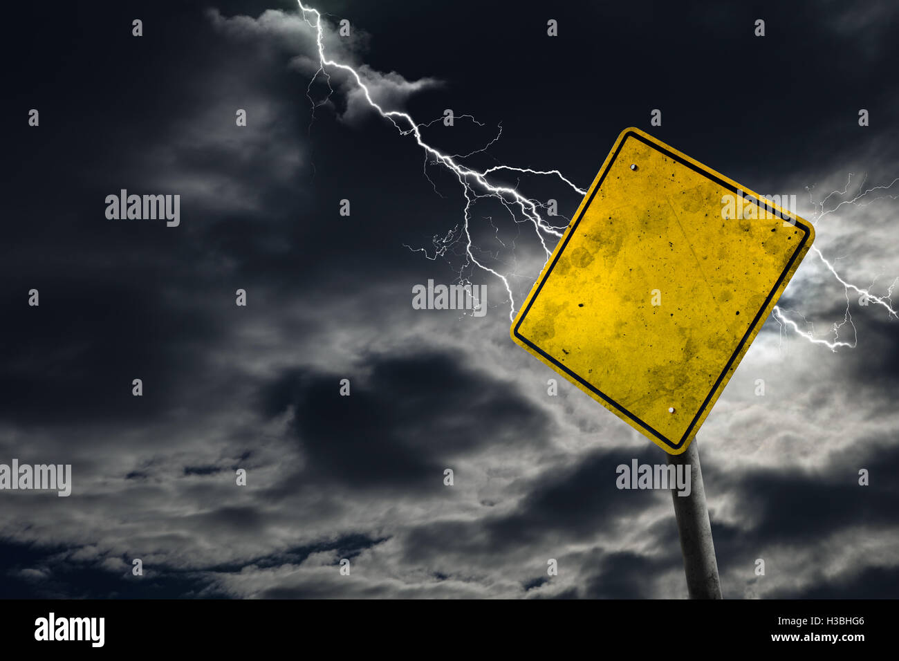 Empty and dirty road sign against a stormy background for any message. Concept of imminent danger and risk ahead with copy space Stock Photo