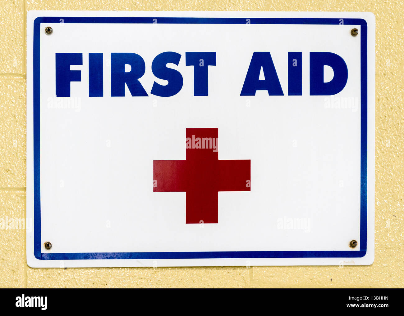 First aid sign on the wall of a swimming pool Stock Photo Alamy