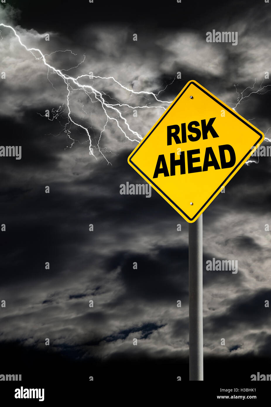 Risk Ahead warning sign against a dark, cloudy and thunderous sky. Concept of political storm, personal crisis, or imminent dang Stock Photo