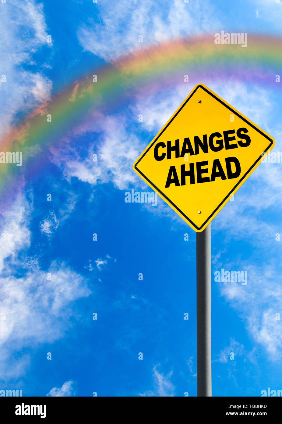 Changes Ahead sign against a blue sky with rainbow and copy space. Concept of situation changing for the better. Vertical orient Stock Photo