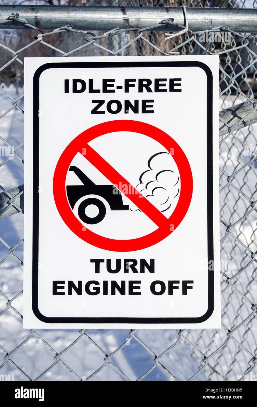 Idle-Free Zone, Turn Engine Off Sign on a Fence Stock Photo