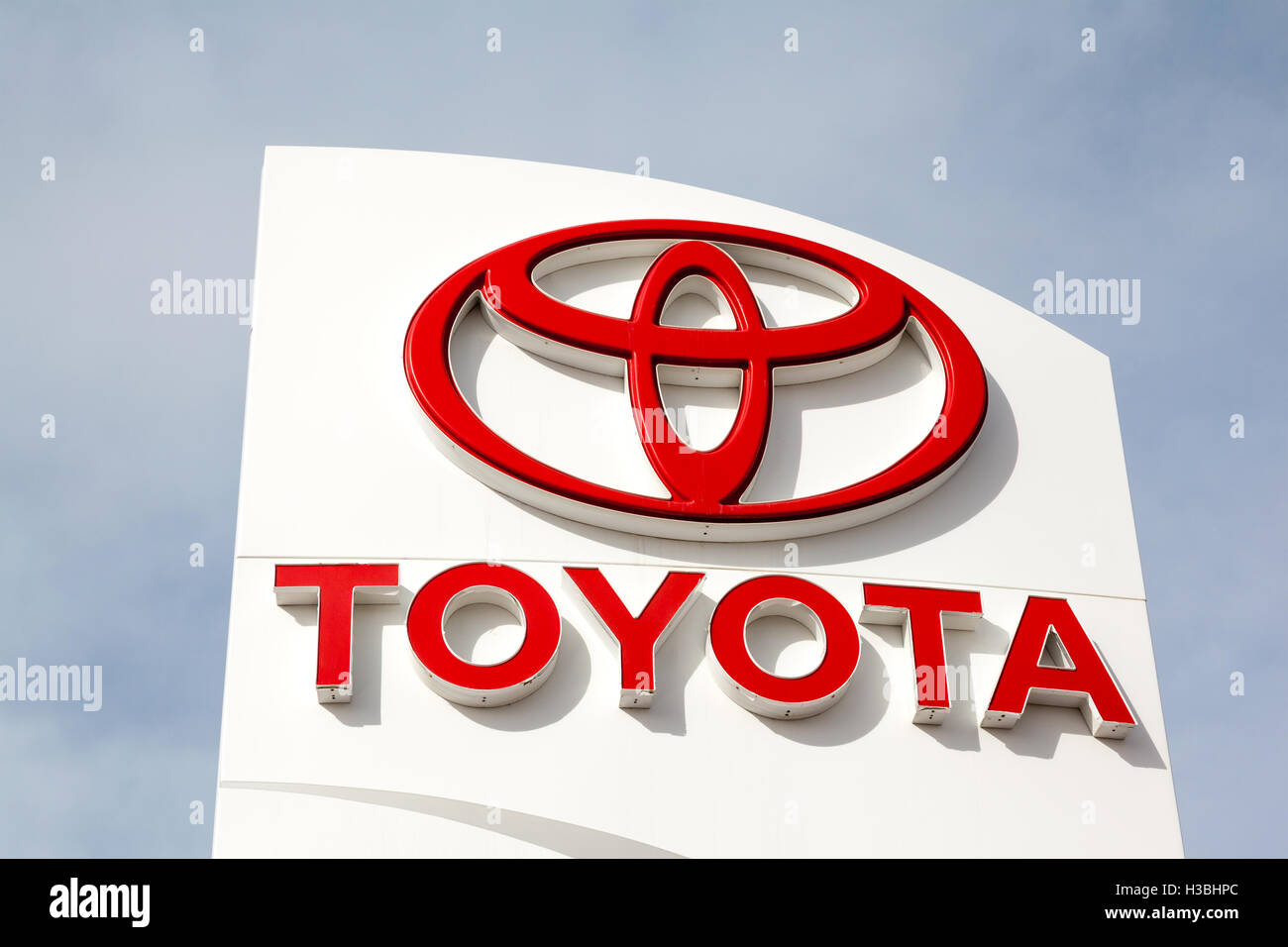 Calgary, Alberta, Canada - March 19, 2014: A Toyota Motor Corporation sign at a car dealership. Toyota reached a $1.2 billion se Stock Photo