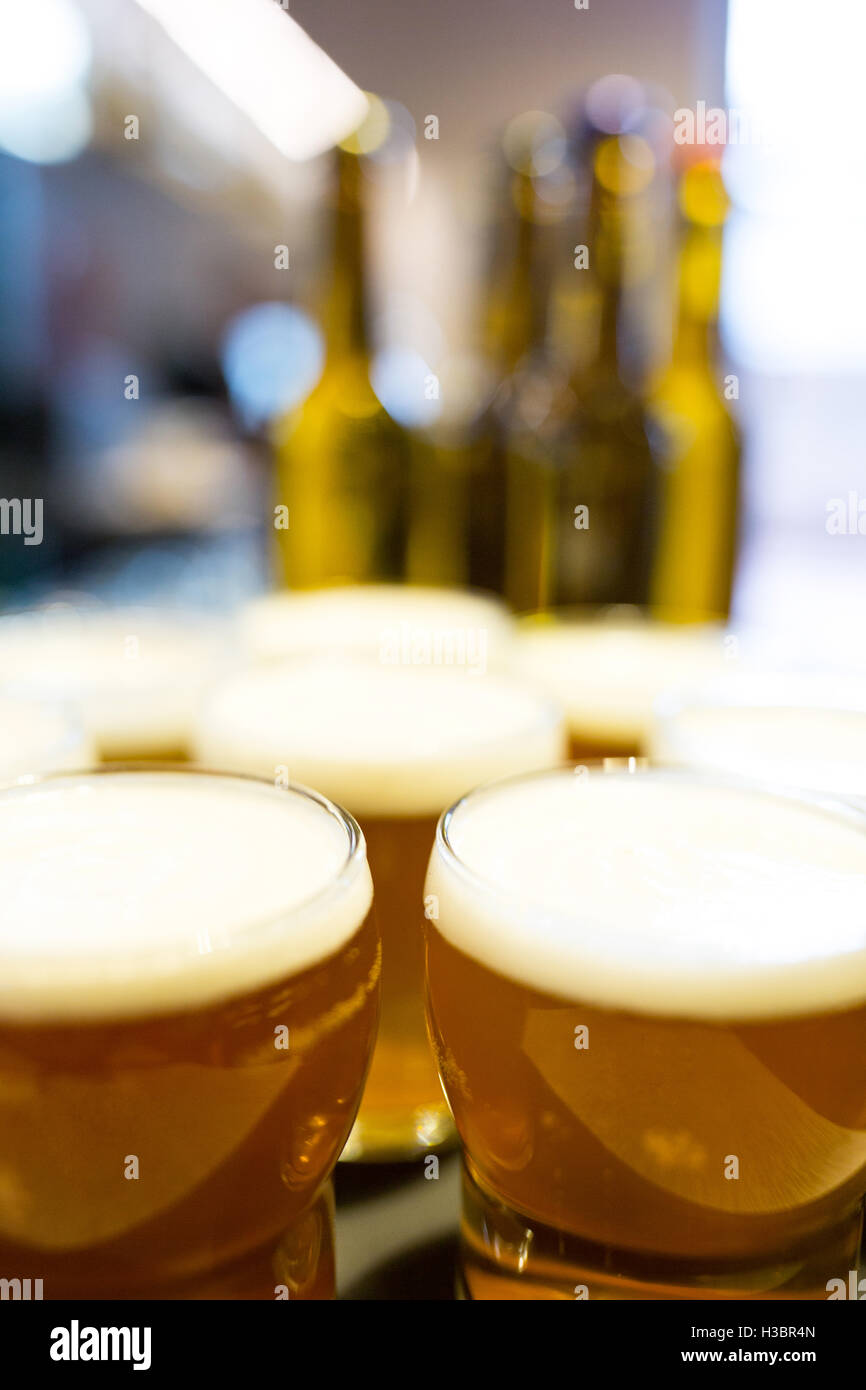 Close-up of beer glasses on the counter Stock Photo