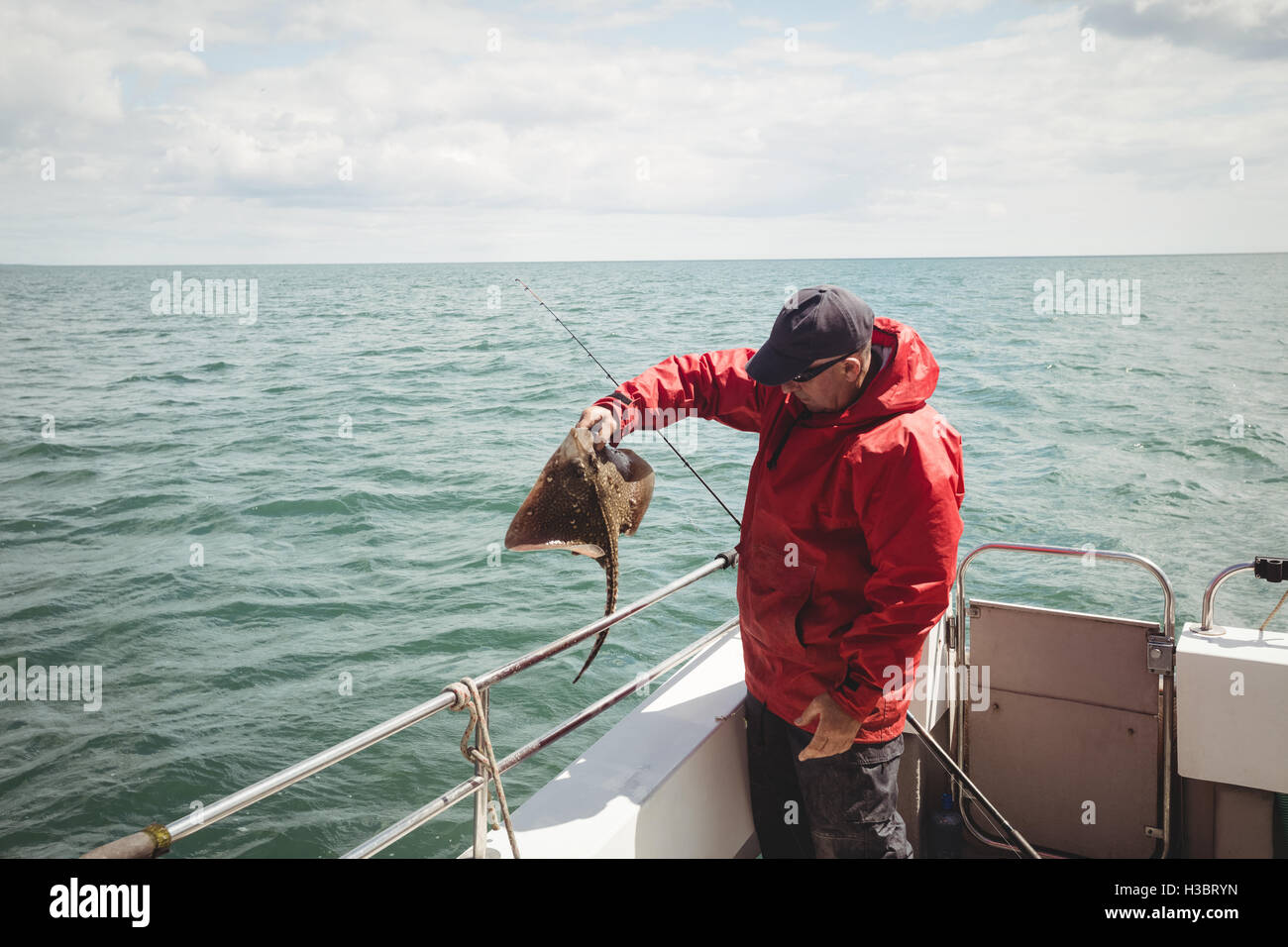 Fisherman catching a fish Stock Photo