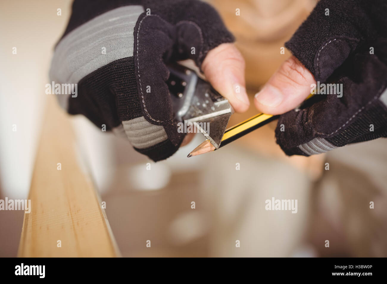 Carpenter's hands sharpening a pencil Stock Photo Alamy