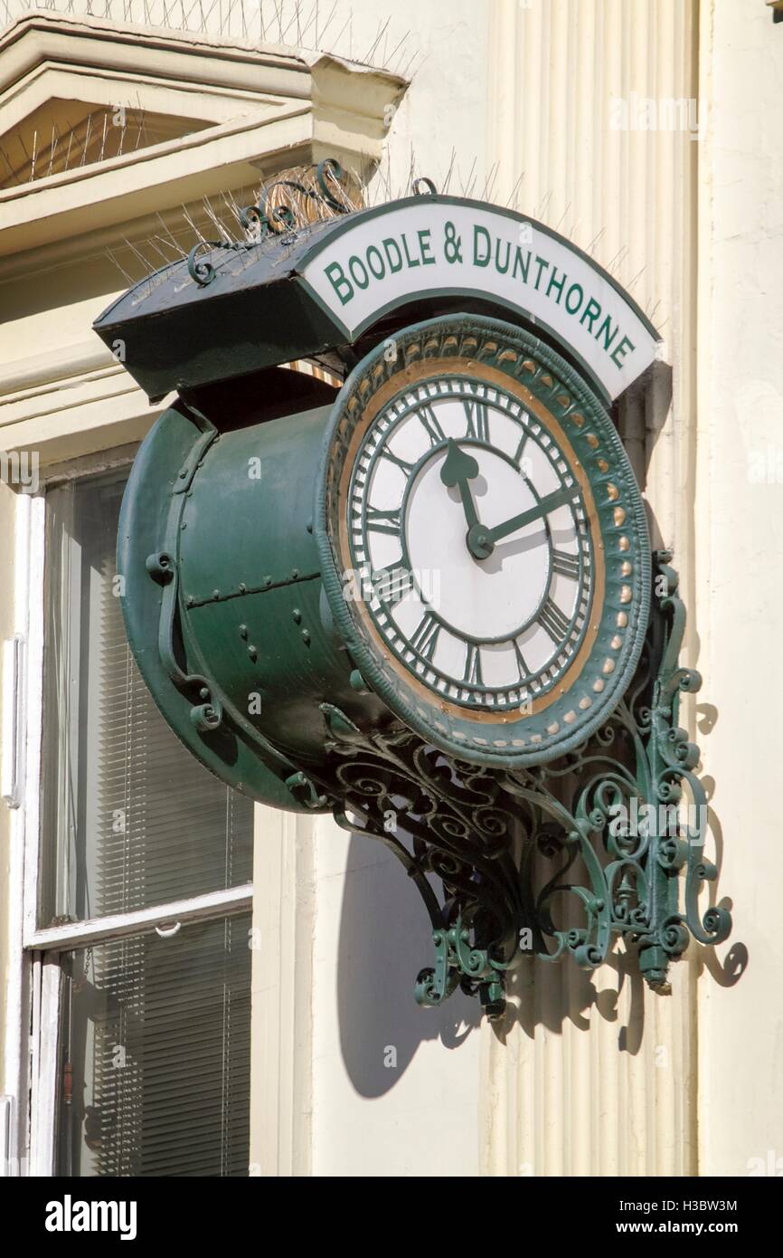Antique style wall mounted clock on Boodles Jewellers in Liverpool city centre, Merseyside, uk
