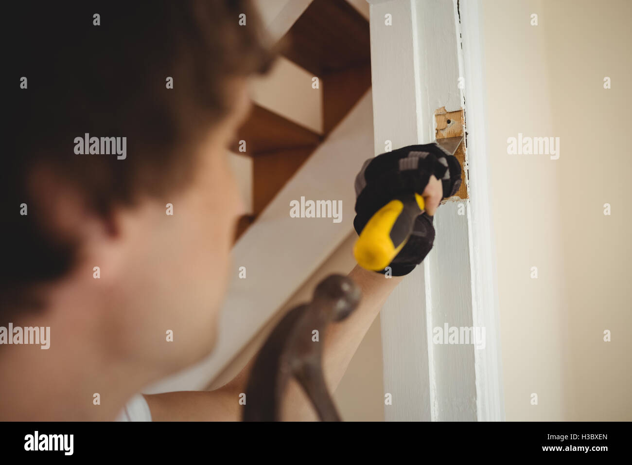 Carpenter working on a door frame Stock Photo Alamy