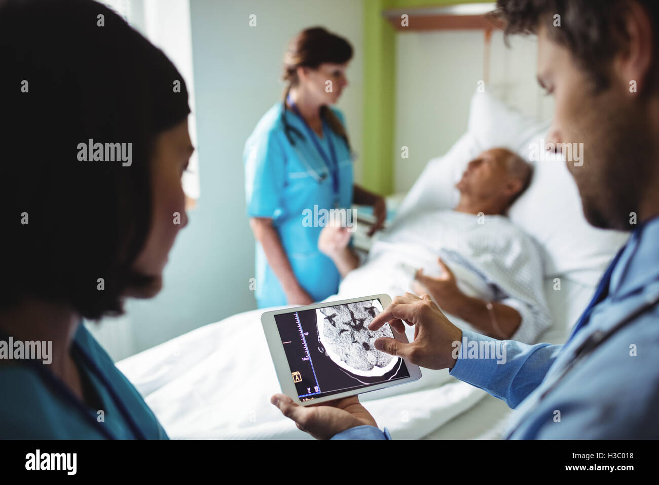 Male doctor and nurse using digital tablet Stock Photo