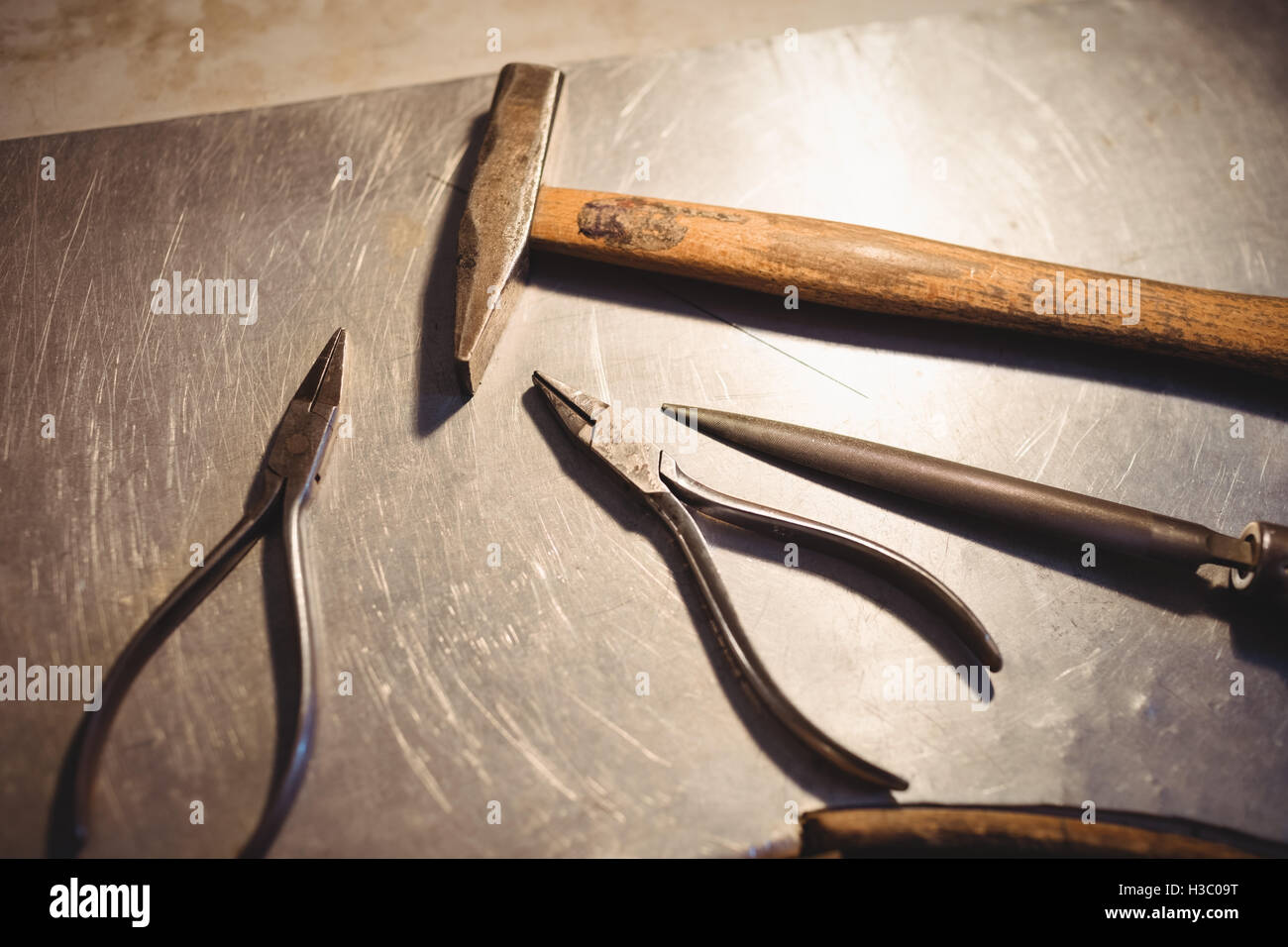 Goldsmith work tools on workbench Stock Photo
