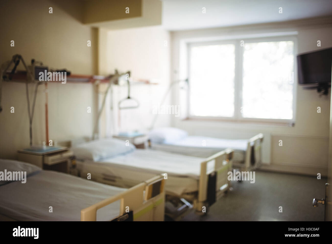 Empty wards with beds and medical equipment Stock Photo