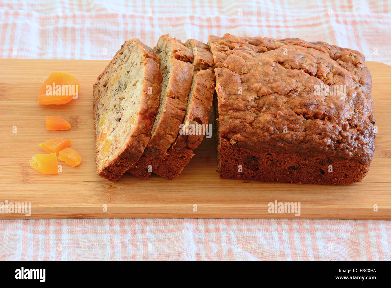 Fresh baked banana bread with sweet apricot pieces in horizontal format Stock Photo
