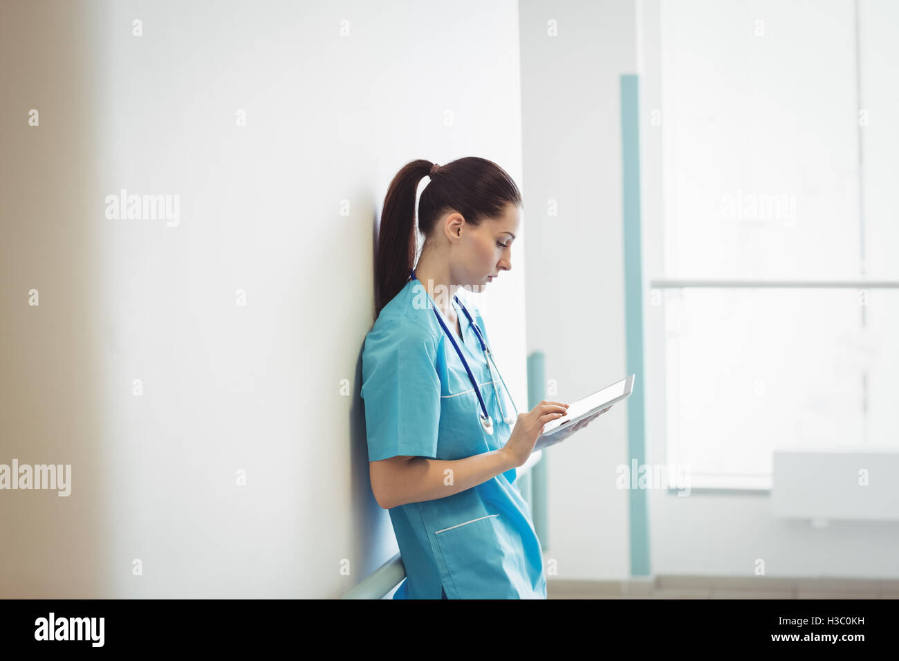 Nurse using digital tablet Stock Photo