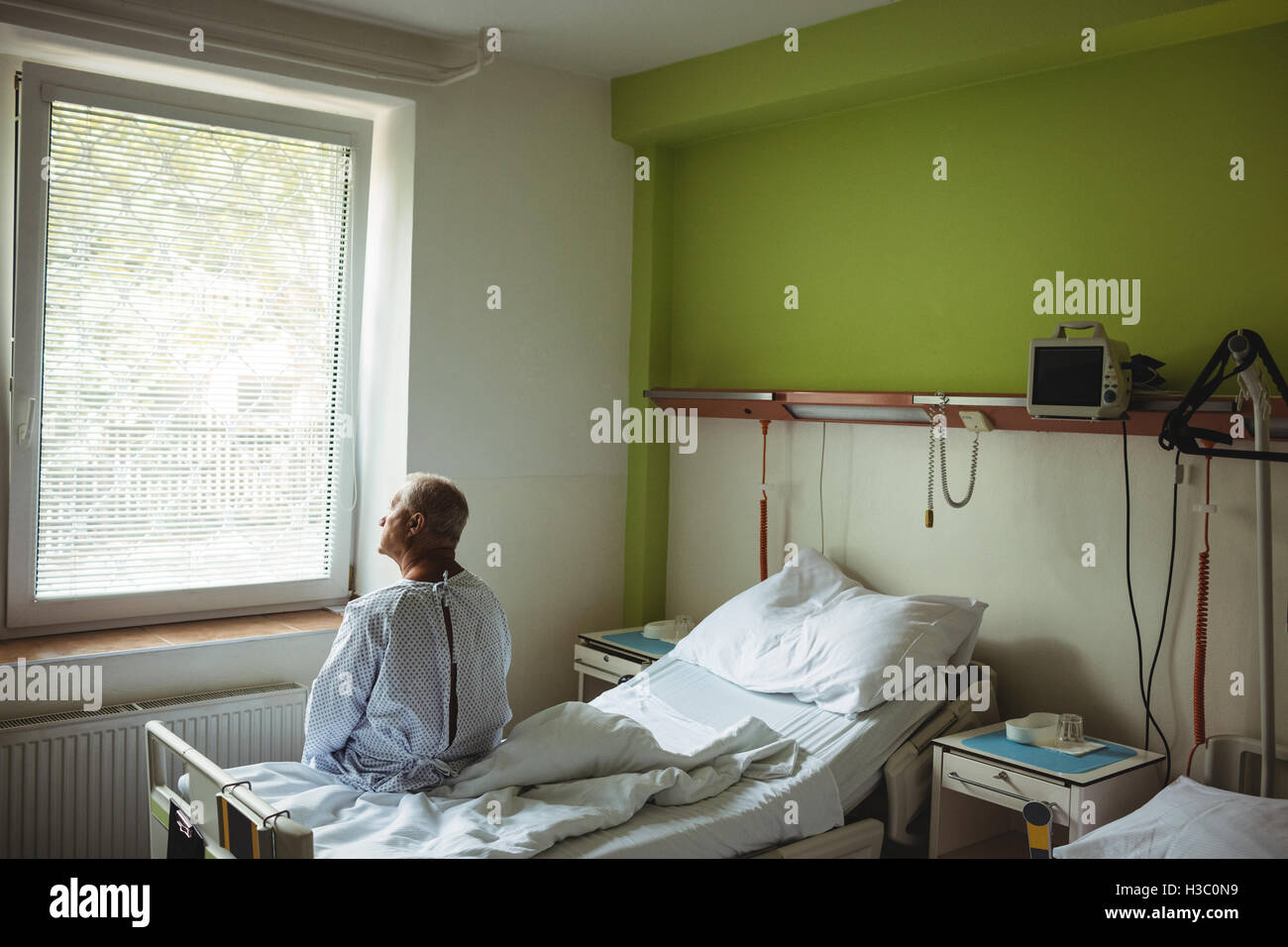 Man on hospital bed hi-res stock photography and images - Alamy