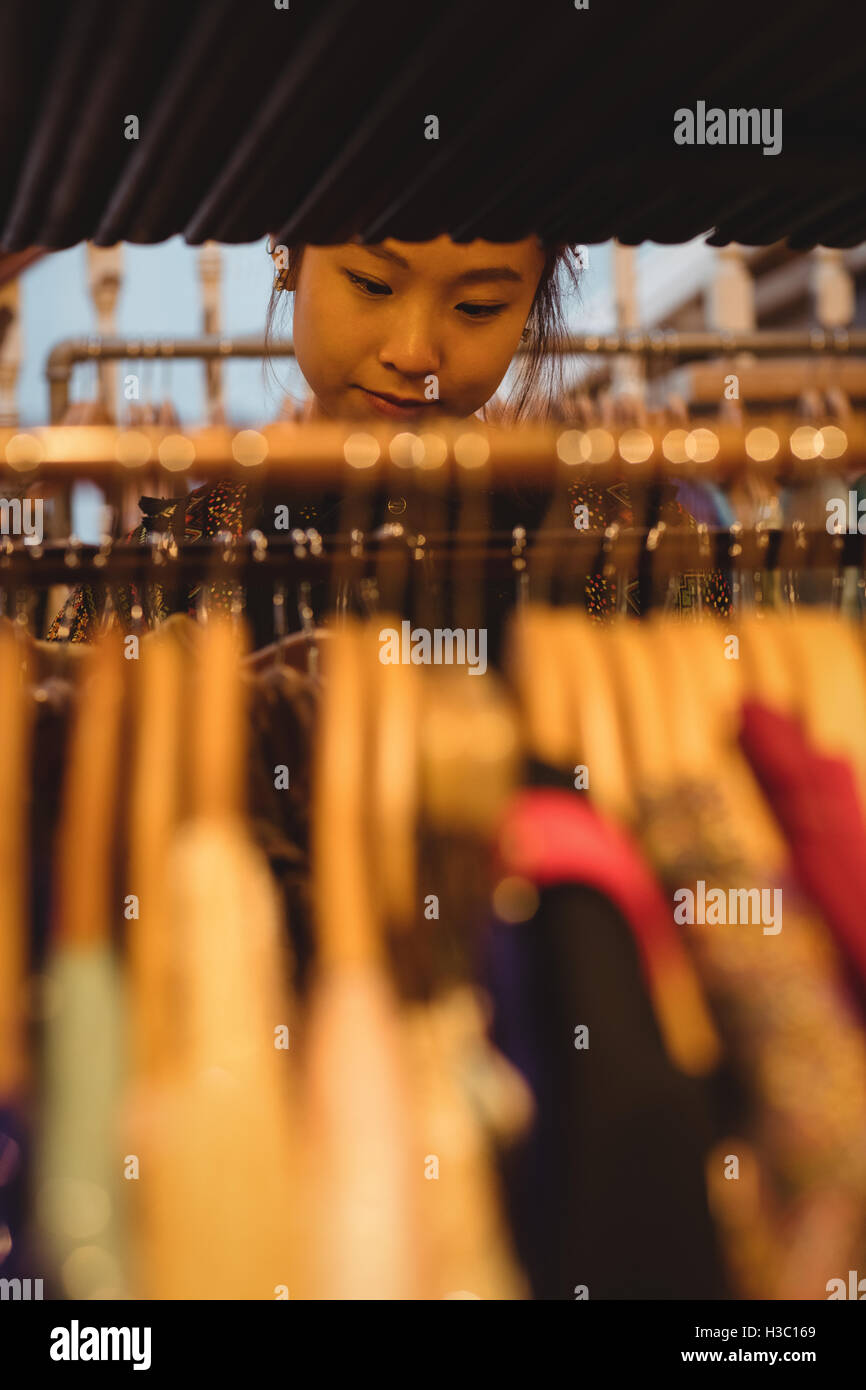 Woman selecting a clothes Stock Photo - Alamy