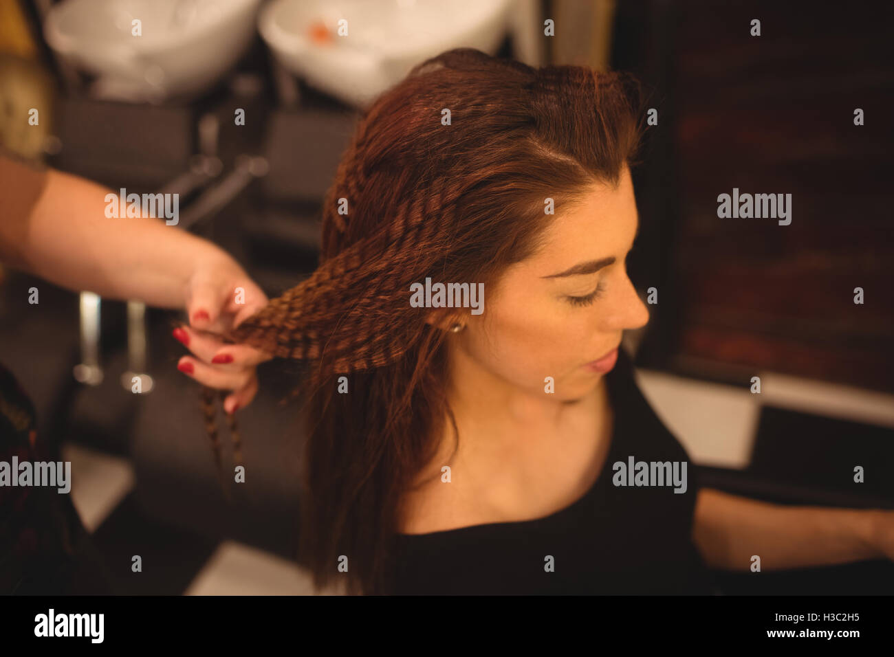 Woman Styling Her Hair At Saloon Stock Photo 122582017 Alamy