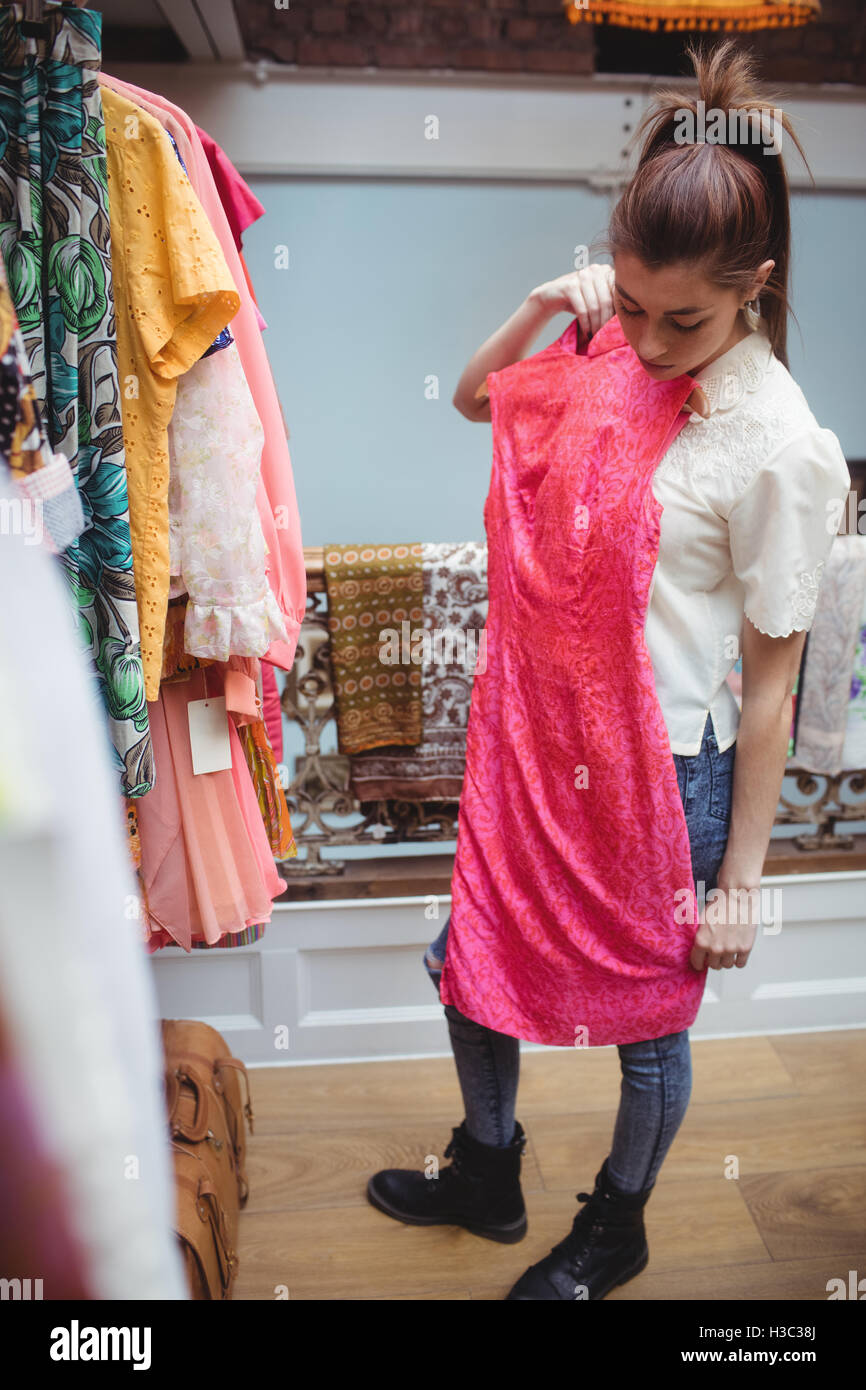 Woman selecting a clothes Stock Photo - Alamy