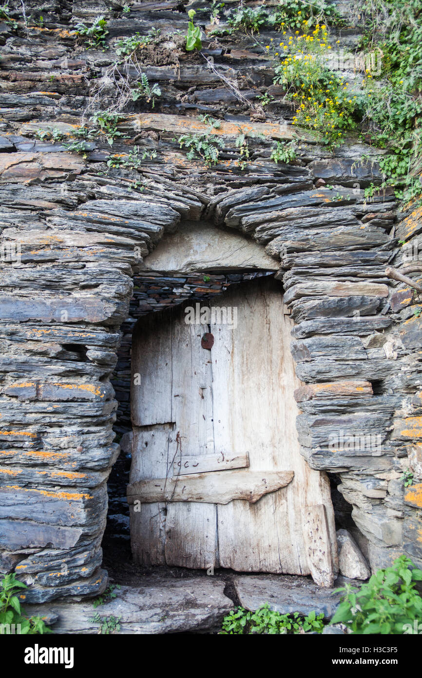 Color image of an old door on a stone wall Stock Photo - Alamy