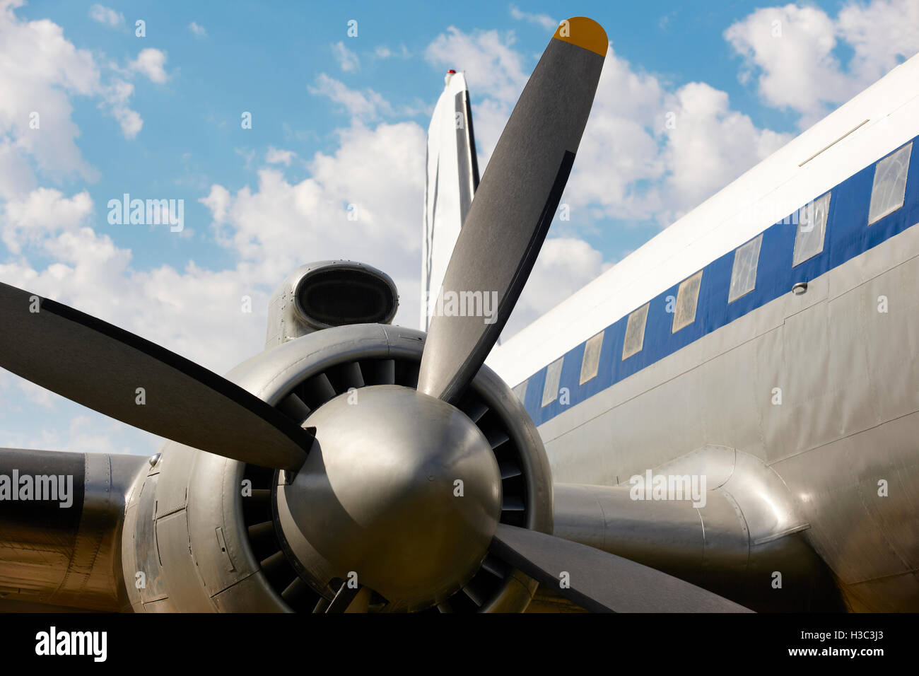 Old aircraft propeller and airframe with blue sky background ...