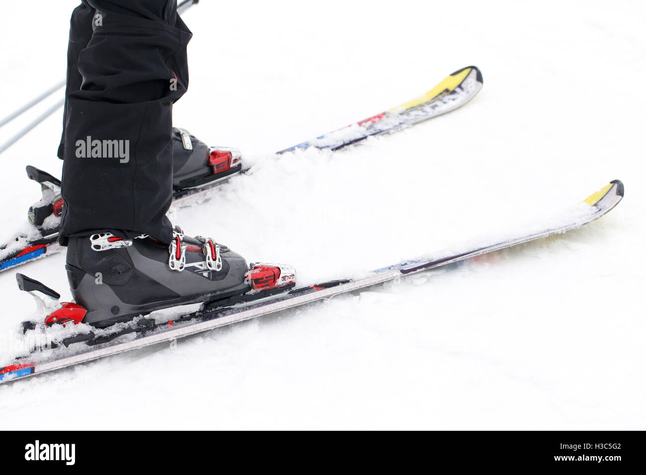 a foot closeup skier, winter sports background Stock Photo