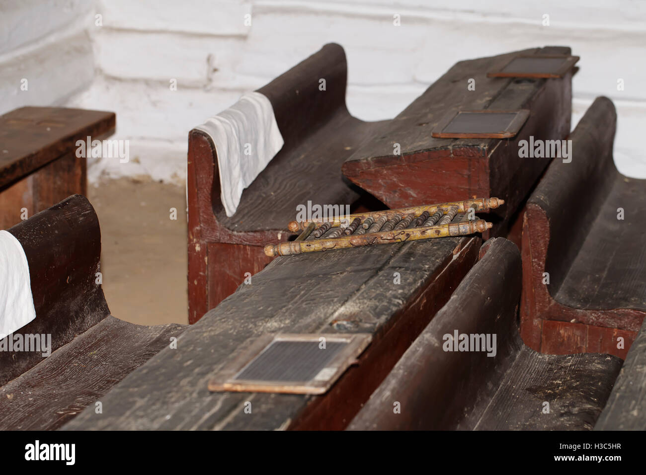 a schoolroom, old vintage wooden desk background education Stock Photo