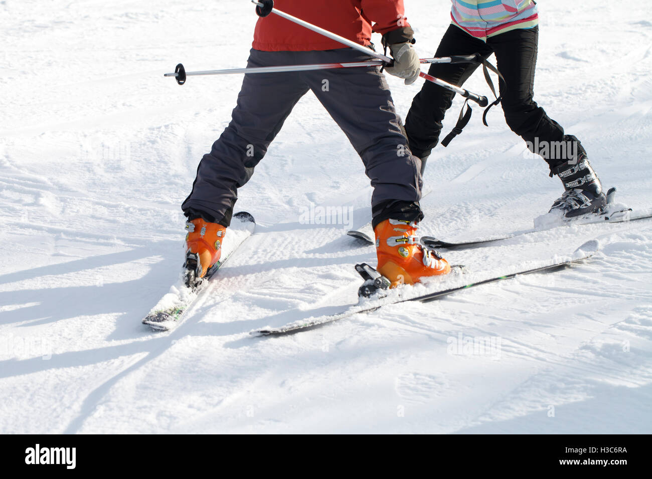 The instructor teaches Woman skiing, winter recreation Stock Photo