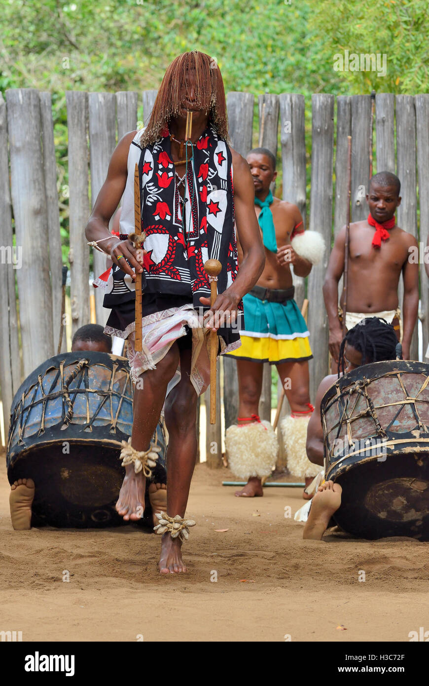 Swazi traditional troupe singing and dancing at the  Mantenga Swazi Cultural Village (Ligugu Lemaswati) Ezulwini Valley, Eswatini (formerly Swaziland) Stock Photo