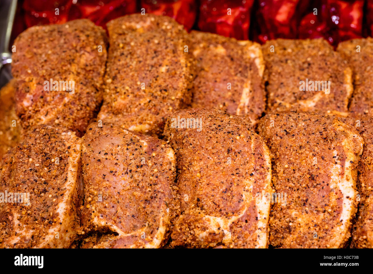 Marinade meat at display counter Stock Photo